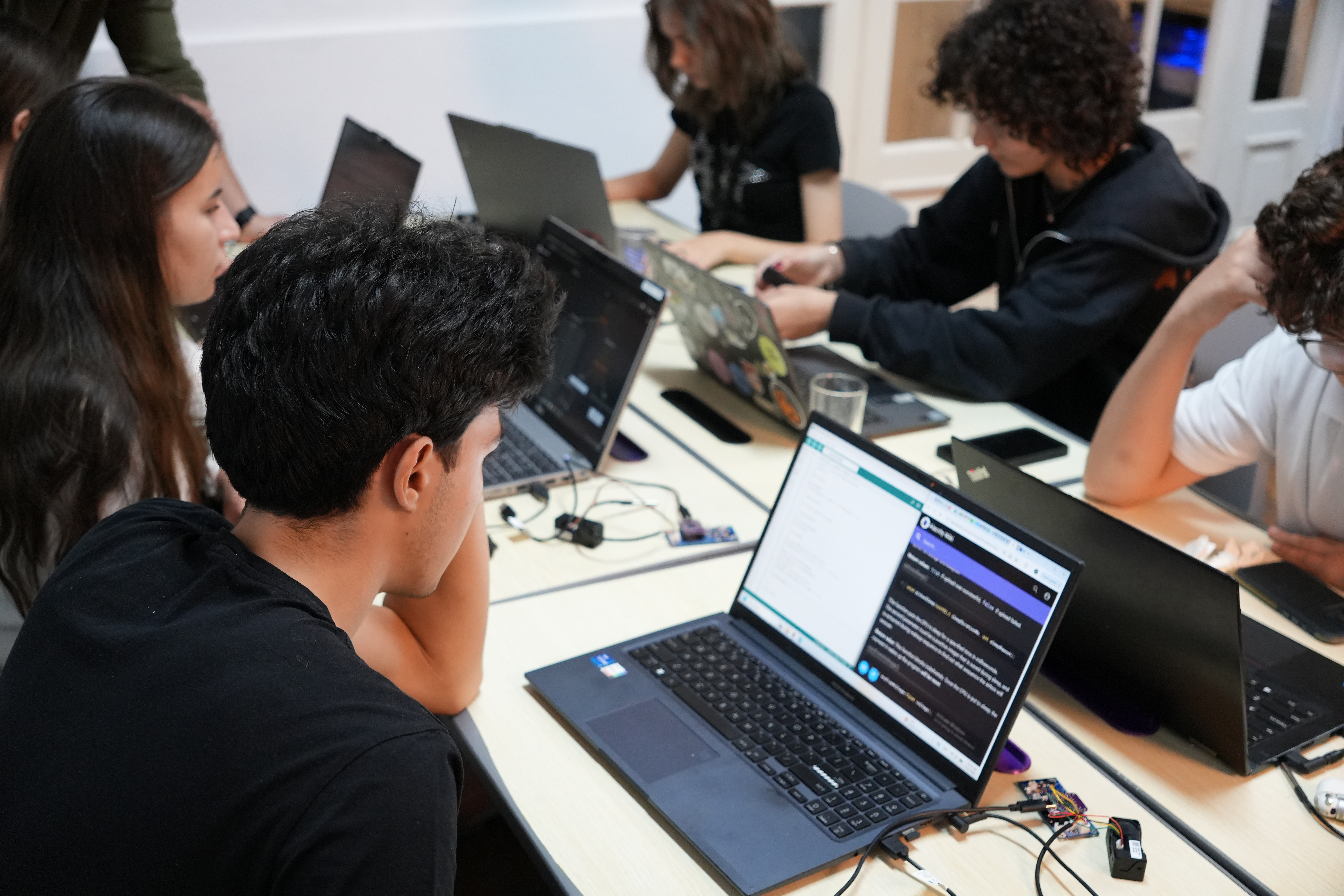 Students working on laptops during bootcamp