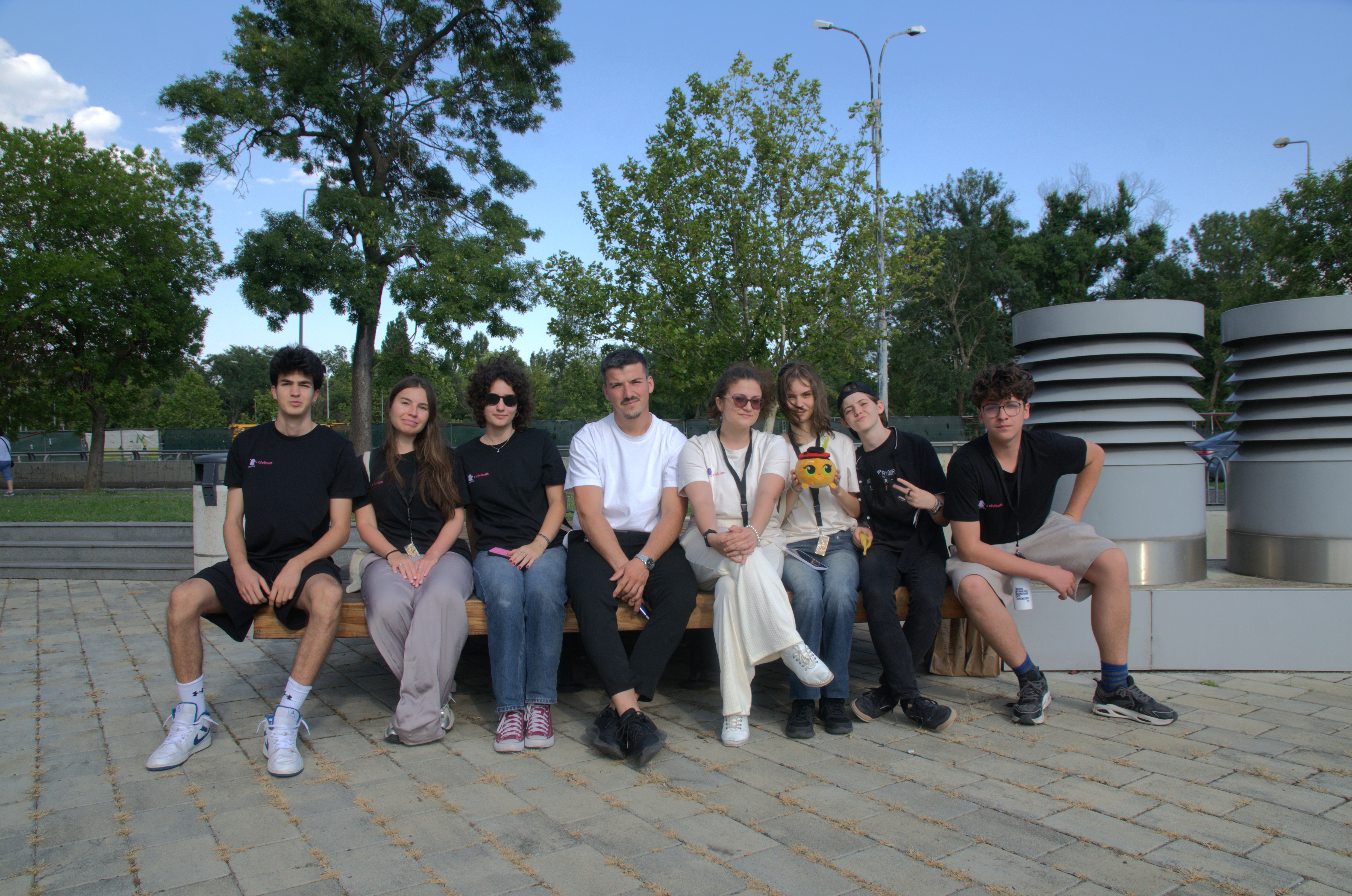 AirBox Bootcamp group sitting on a bench outdoors in a park